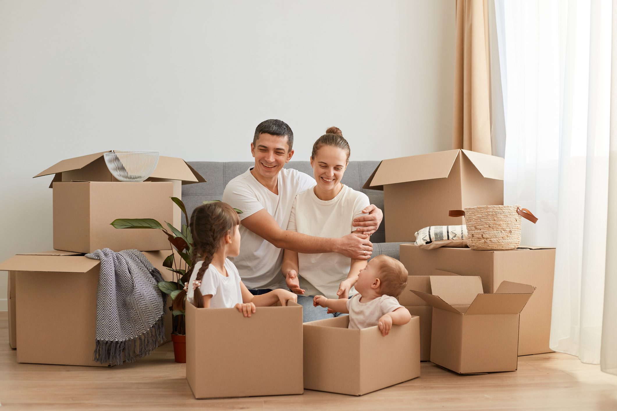 Happy family surrounded by boxes